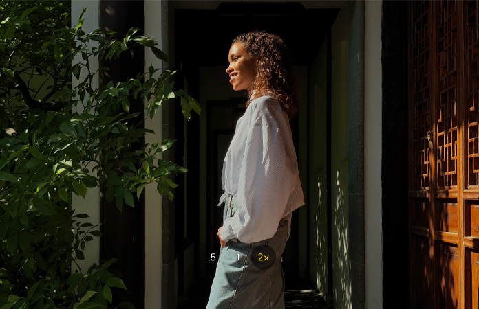Picture of a woman with 2x Telephoto camera feature